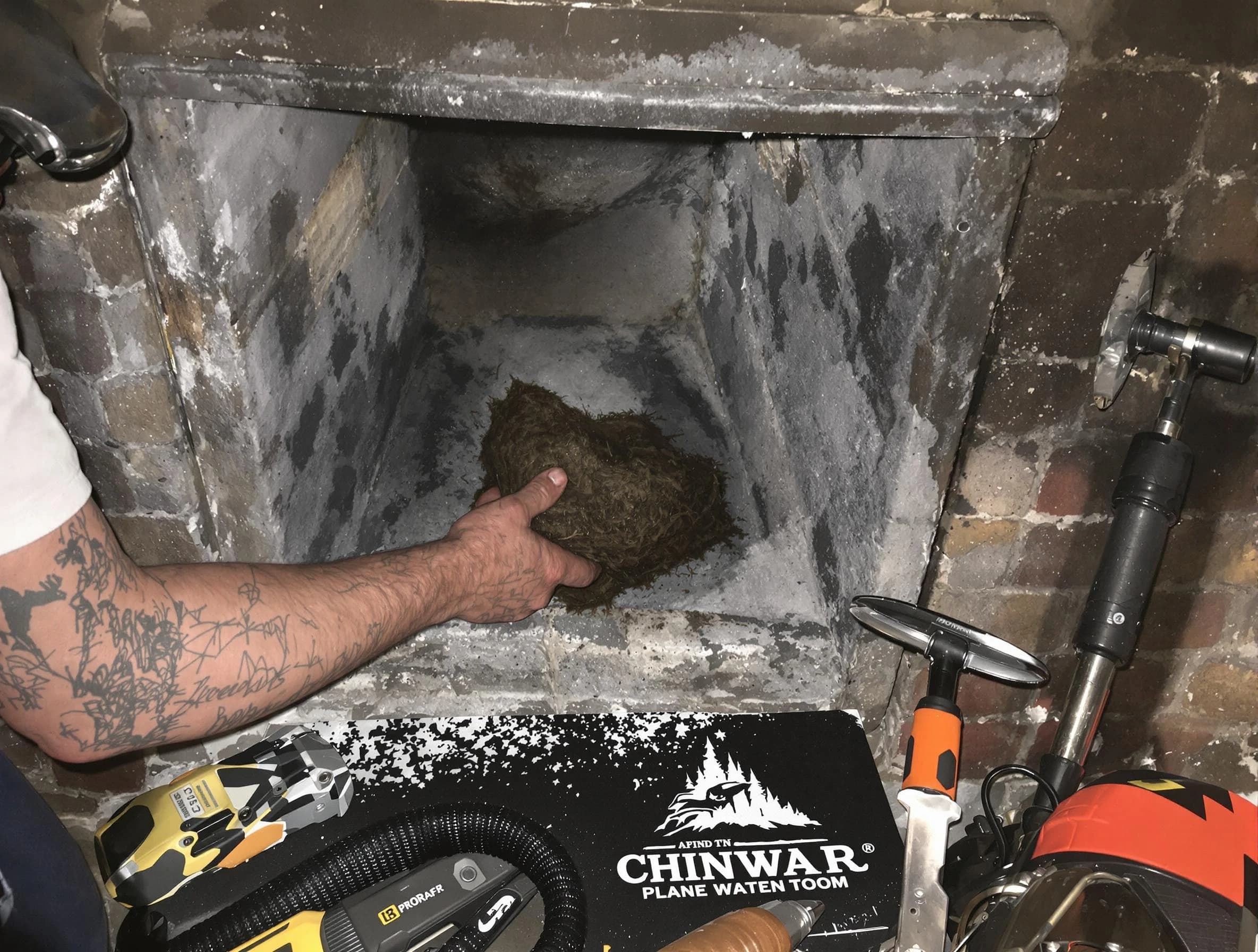 Walpole Chimney Sweep safely removing debris and screening chimney in Walpole, MA